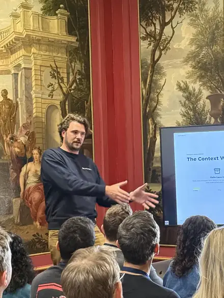 A trainer answering a question in front of the room