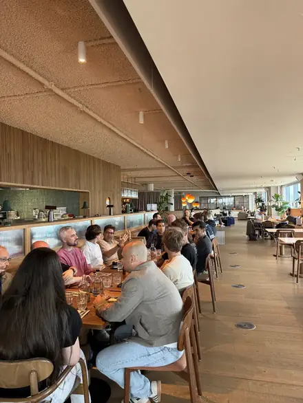 Participants having lunch at long tables