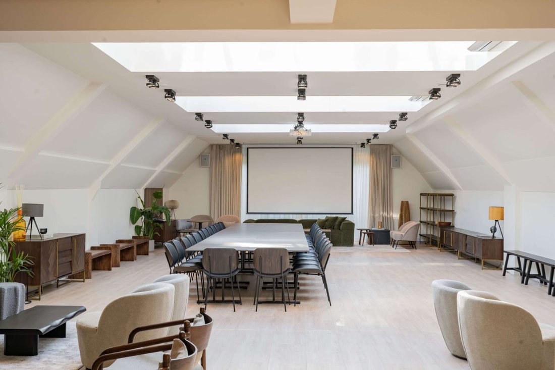 The workshop room at The Schoolstraat, one long table under the skylights